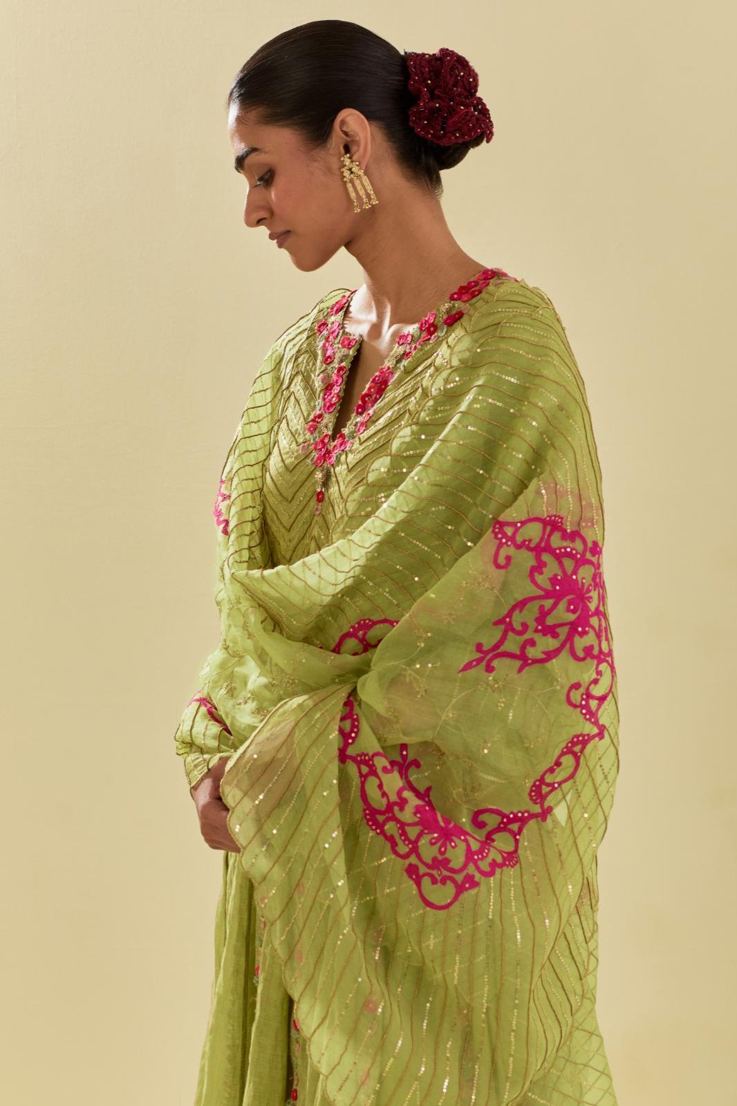 Green silk organza dupatta with delicate gold zari embroidery & silk applique work, highlighted with gold sequins and beads.