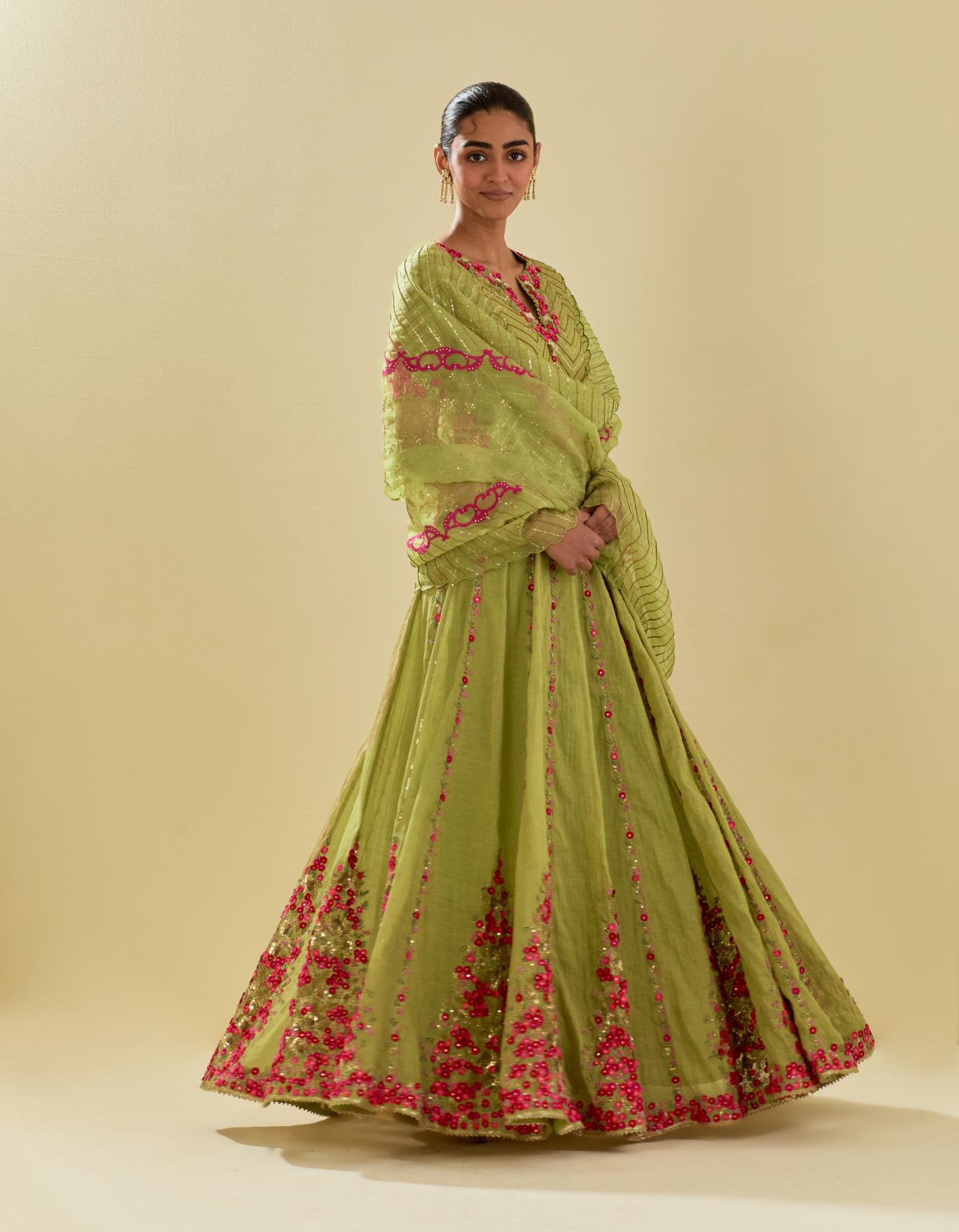 Green tissue chanderi short top set with delicate hand cut silk flower embroidery, highlighted with gold sequins and beads.