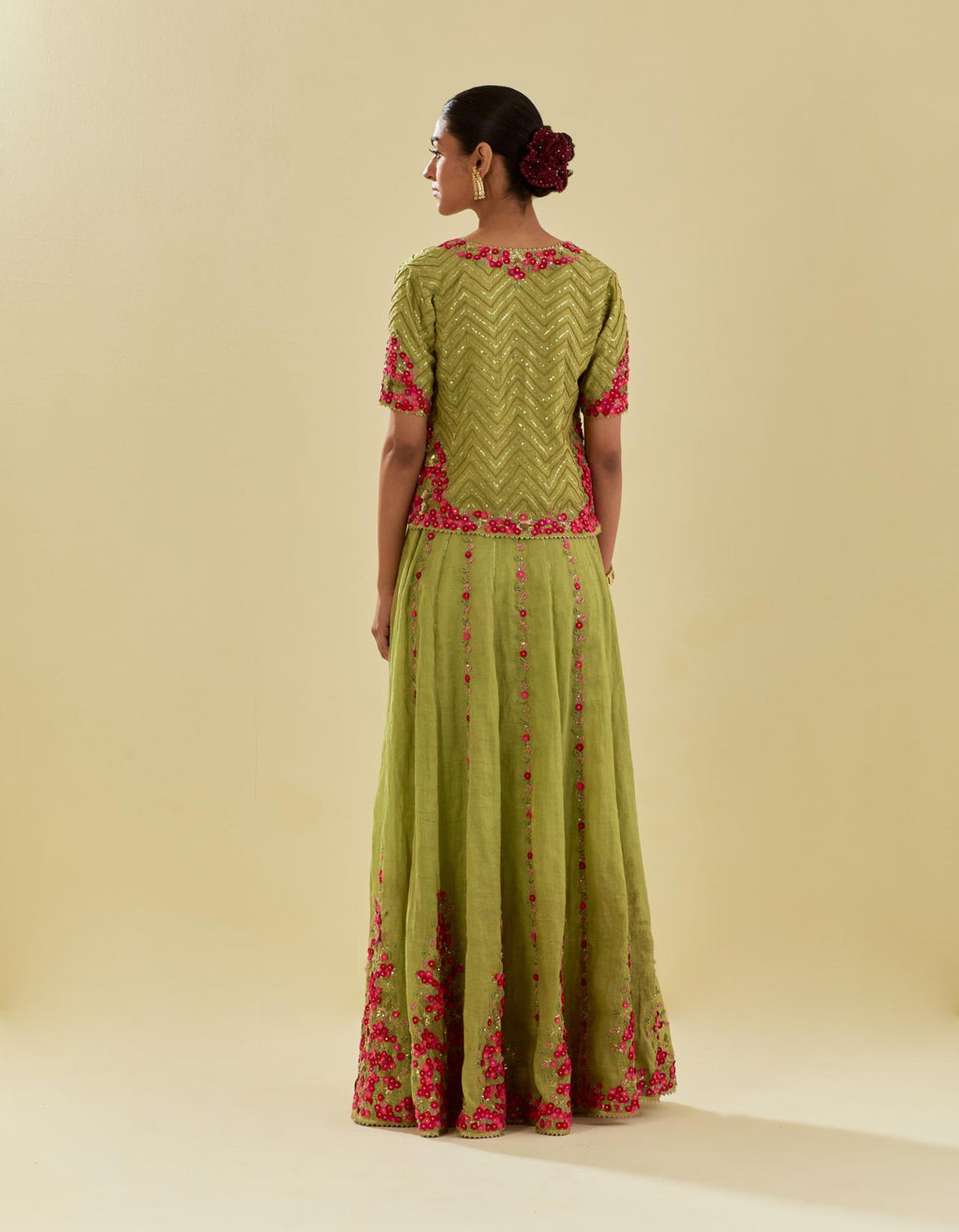 Green tissue chanderi short top set with delicate hand cut silk flower embroidery, highlighted with gold sequins and beads.
