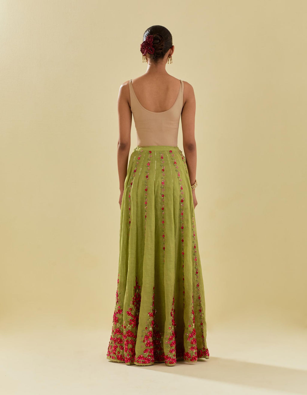 Green tissue chanderi short top set with delicate hand cut silk flower embroidery, highlighted with gold sequins and beads.