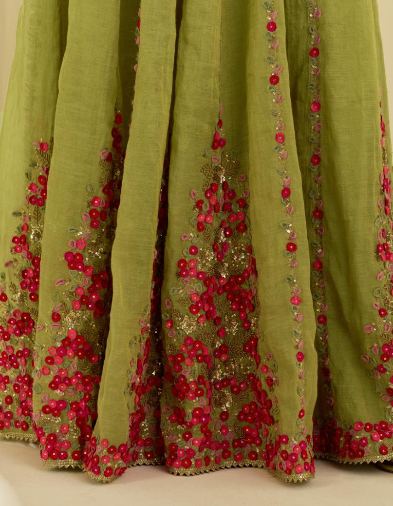 Green tissue chanderi short top set with delicate hand cut silk flower embroidery, highlighted with gold sequins and beads.