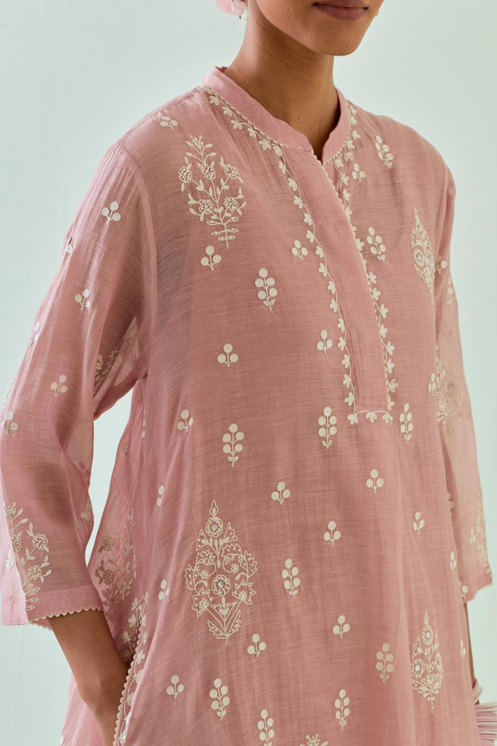 Pink short shirt-kurta set with all-over off white Dori embroidery and highlighted with delicate beaded work.