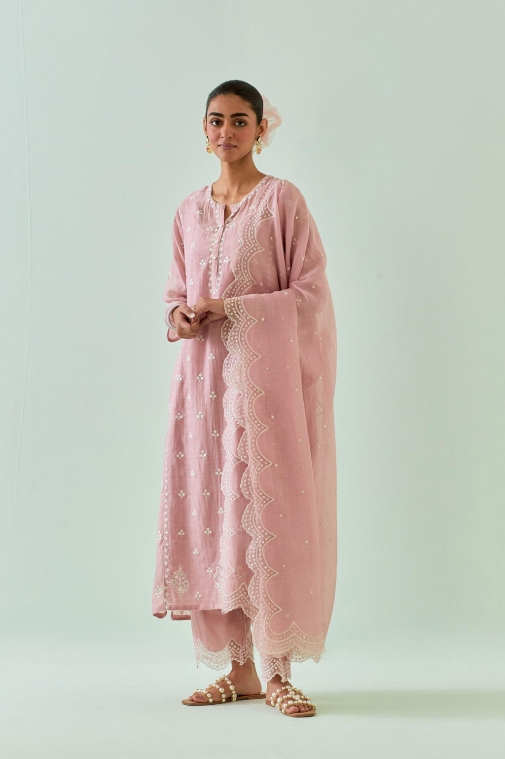 Pink straight kurta set with all-over off white Dori embroidery, highlighted with delicate beaded work and embroidery detail at side panel joint seams.