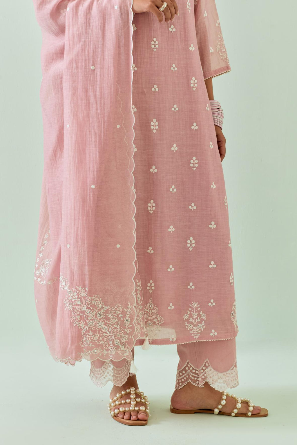 Pink cotton chanderi dupatta with all-over off white embroidery and scalloped edges.