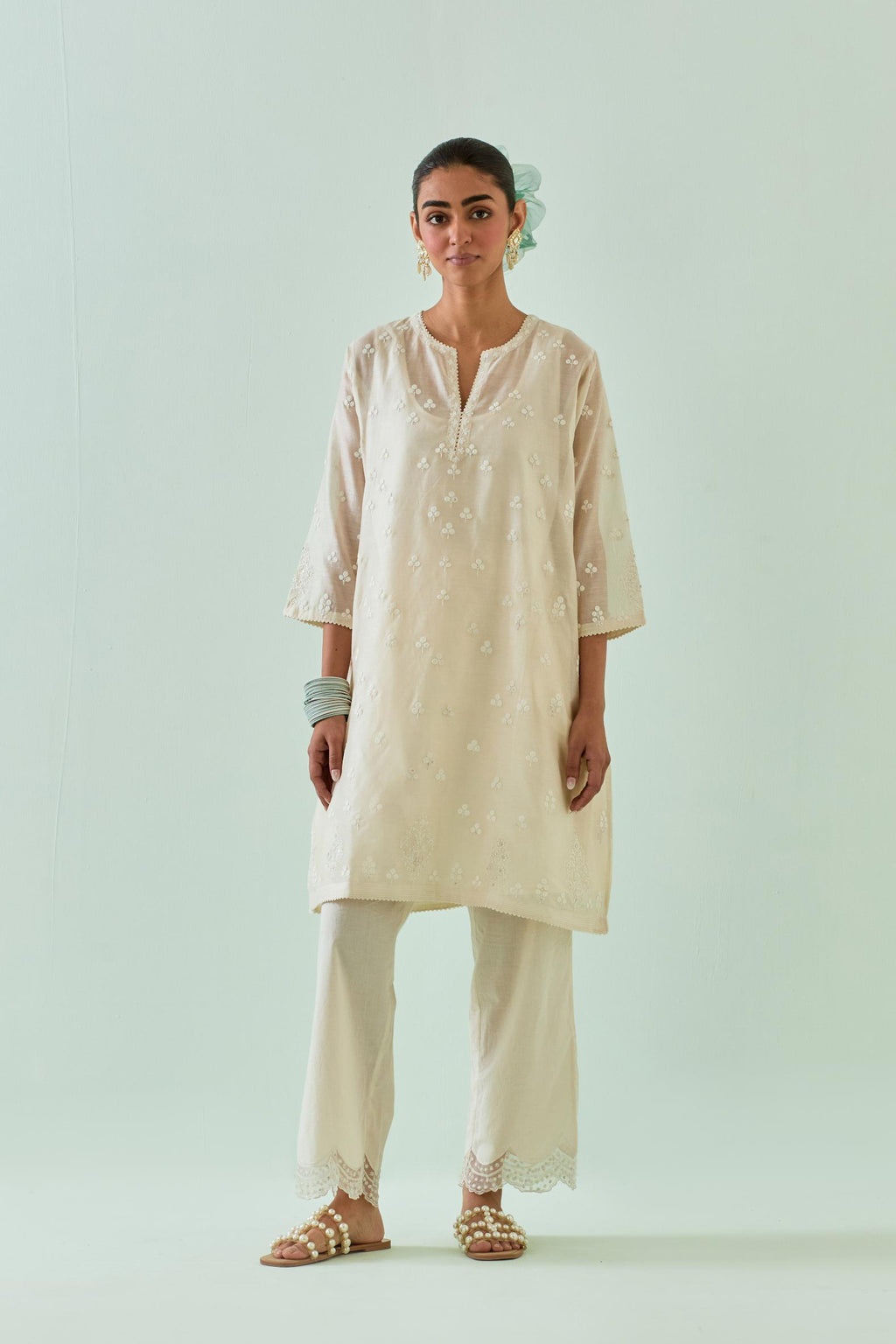 Off white kalidar cotton chanderi short kurta set, highlighted with delicate off-white embroidery.