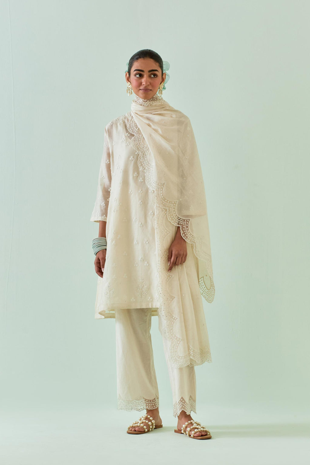 Off white kalidar cotton chanderi short kurta set, highlighted with delicate off-white embroidery.