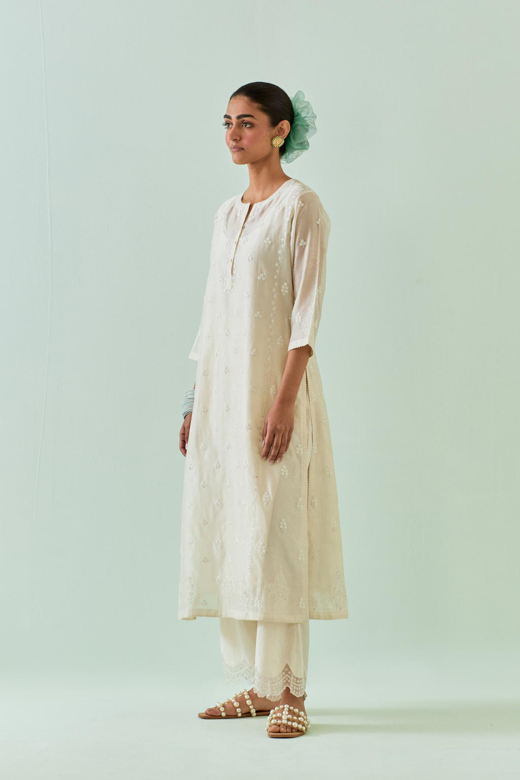 off white straight kurta set with all-over off white Dori embroidery, highlighted with delicate beaded work and embroidery detail at side panel joint seams.