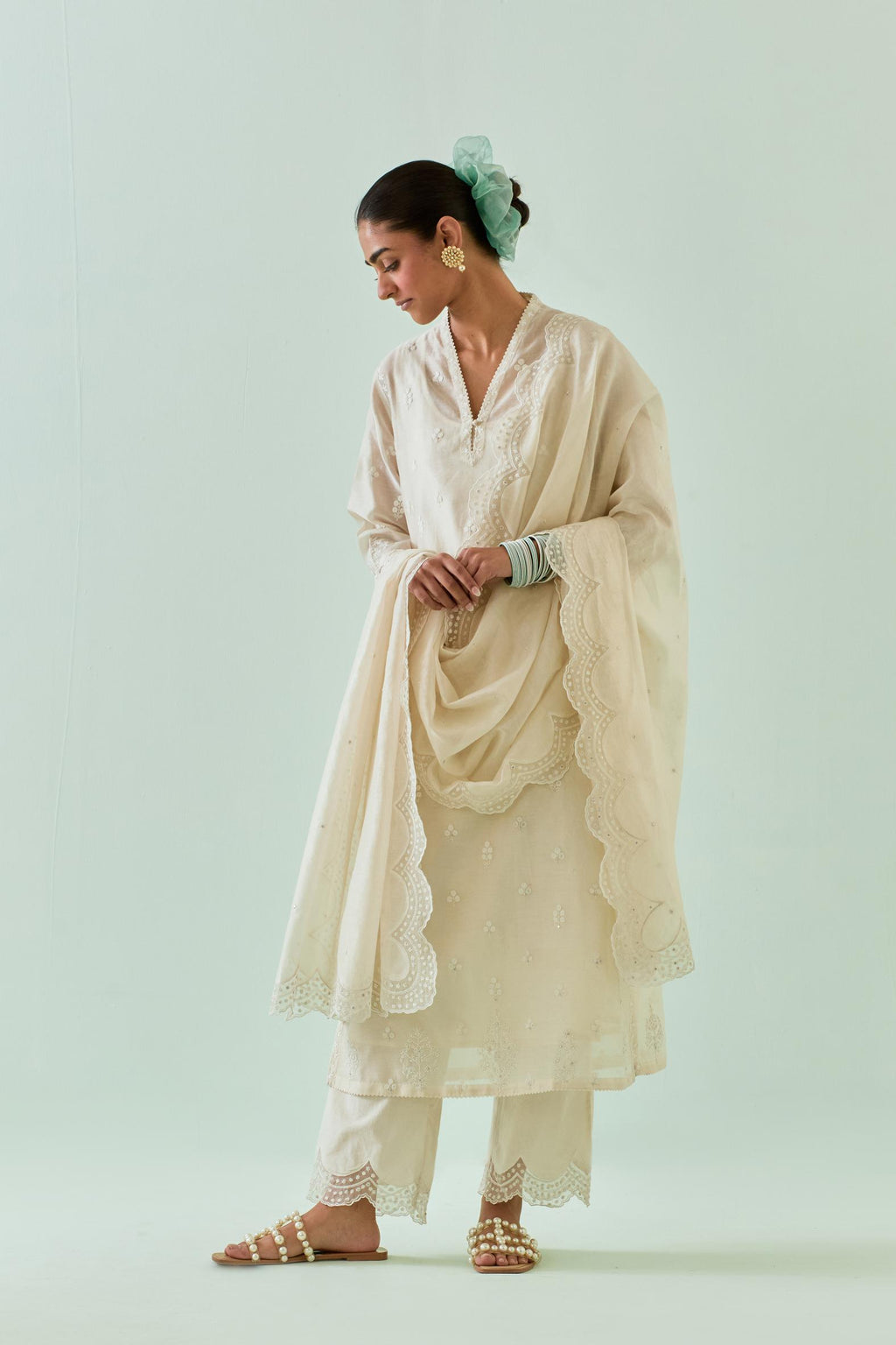 Off white straight kurta set with all-over off white Dori embroidery and highlighted with delicate beaded hand work.