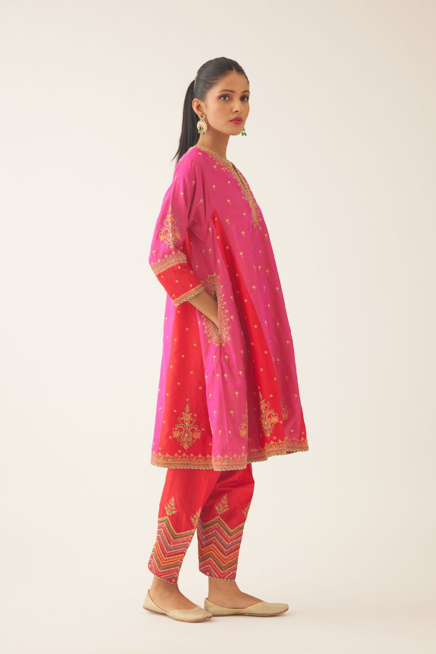 Red & fuchsia silk short kalidar kurta set with all over dori & silk thread embroidery, highlighted with contrast bead & sequins work.