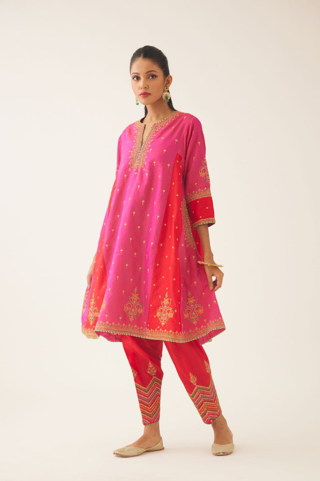 Red & fuchsia silk short kalidar kurta set with all over dori & silk thread embroidery, highlighted with contrast bead & sequins work.