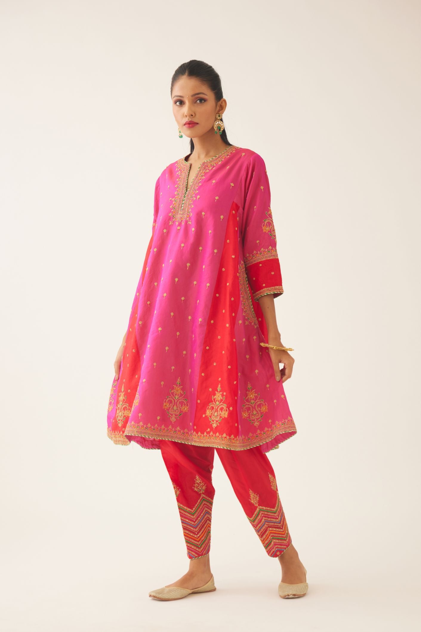 Red & fuchsia silk short kalidar kurta set with all over dori & silk thread embroidery, highlighted with contrast bead & sequins work.