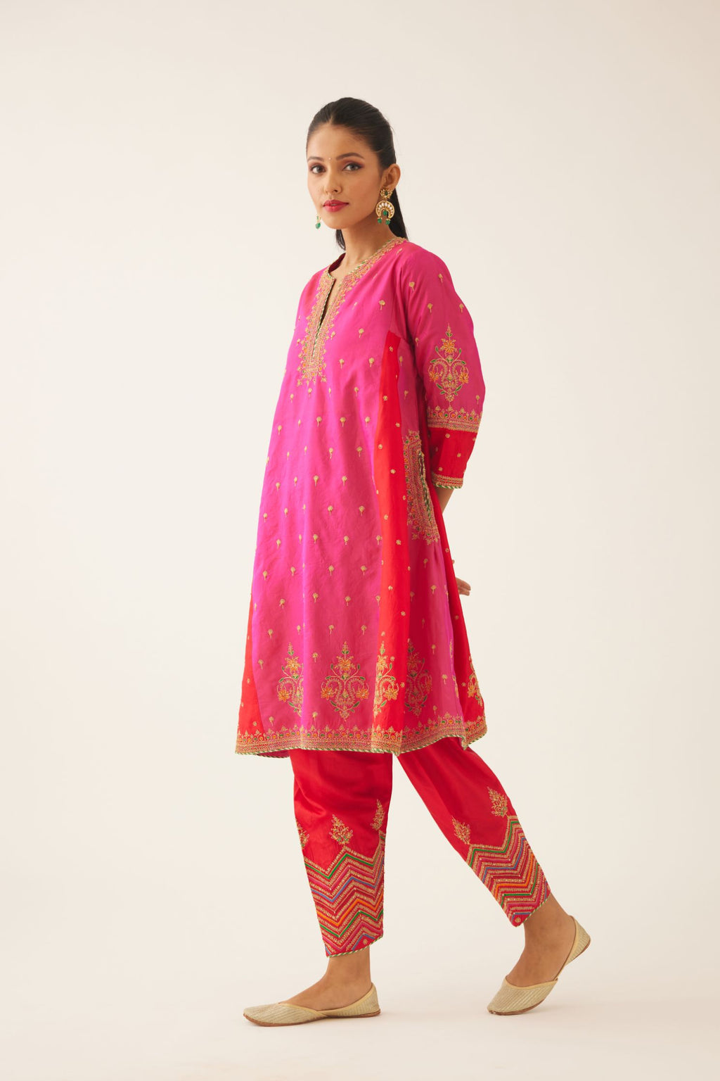 Red & fuchsia silk short kalidar kurta set with all over dori & silk thread embroidery, highlighted with contrast bead & sequins work.