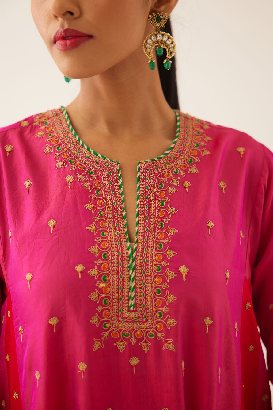 Red & fuchsia silk short kalidar kurta set with all over dori & silk thread embroidery, highlighted with contrast bead & sequins work.