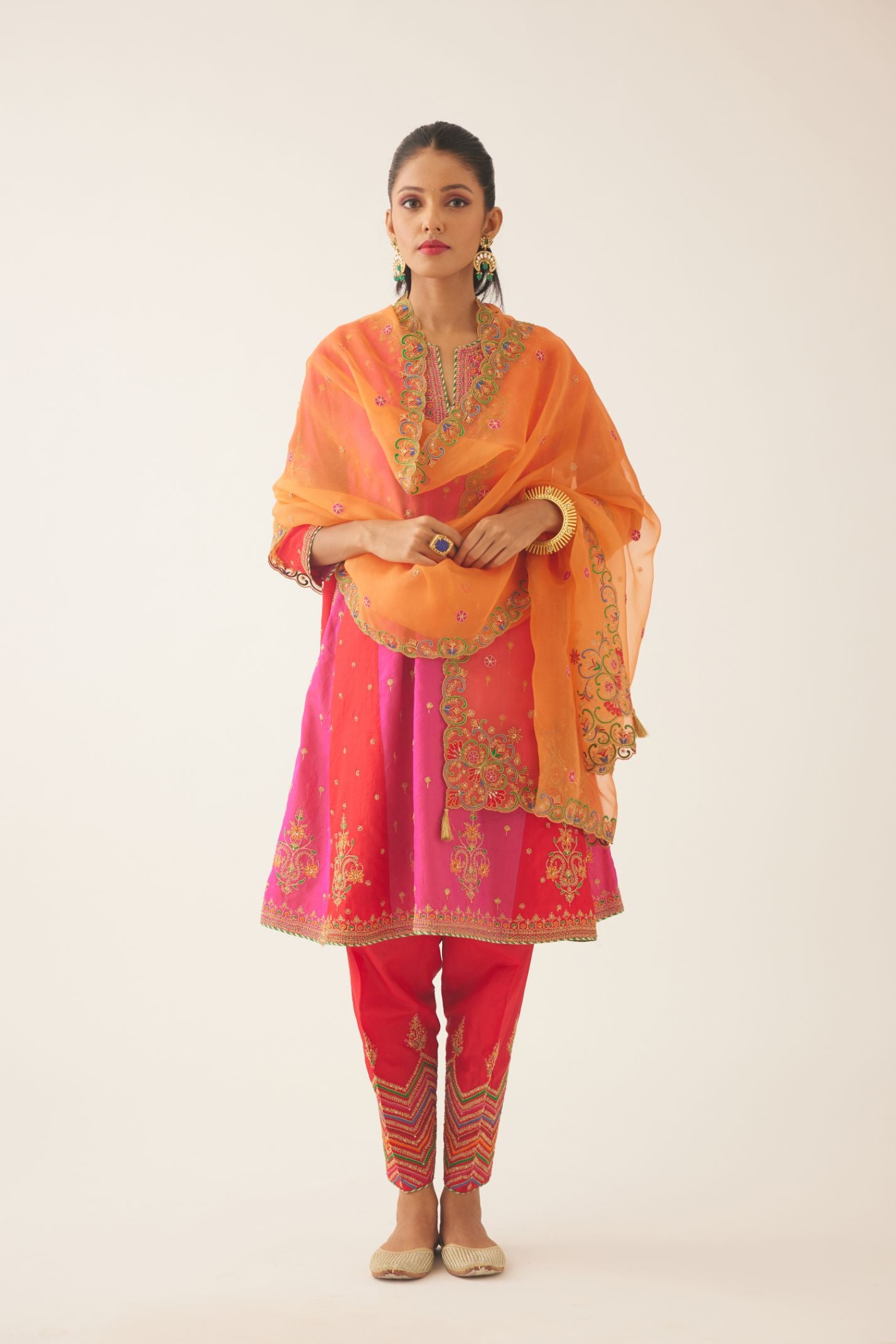 Red & fuchsia silk short kalidar kurta set with all over dori & silk thread embroidery, highlighted with contrast bead & sequins work.