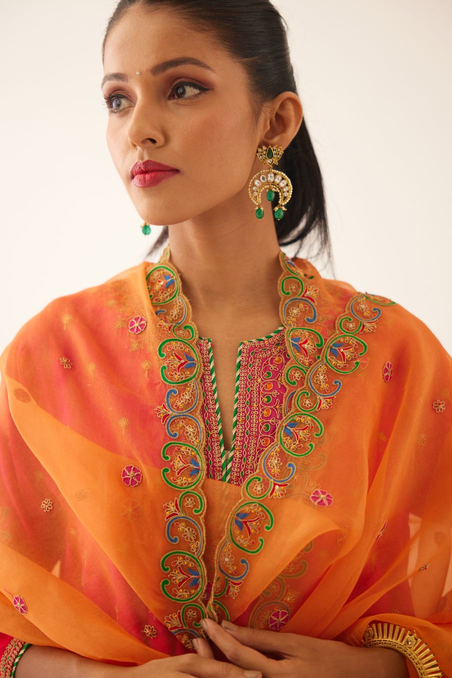 Red & fuchsia silk short kalidar kurta set with all over dori & silk thread embroidery, highlighted with contrast bead & sequins work.