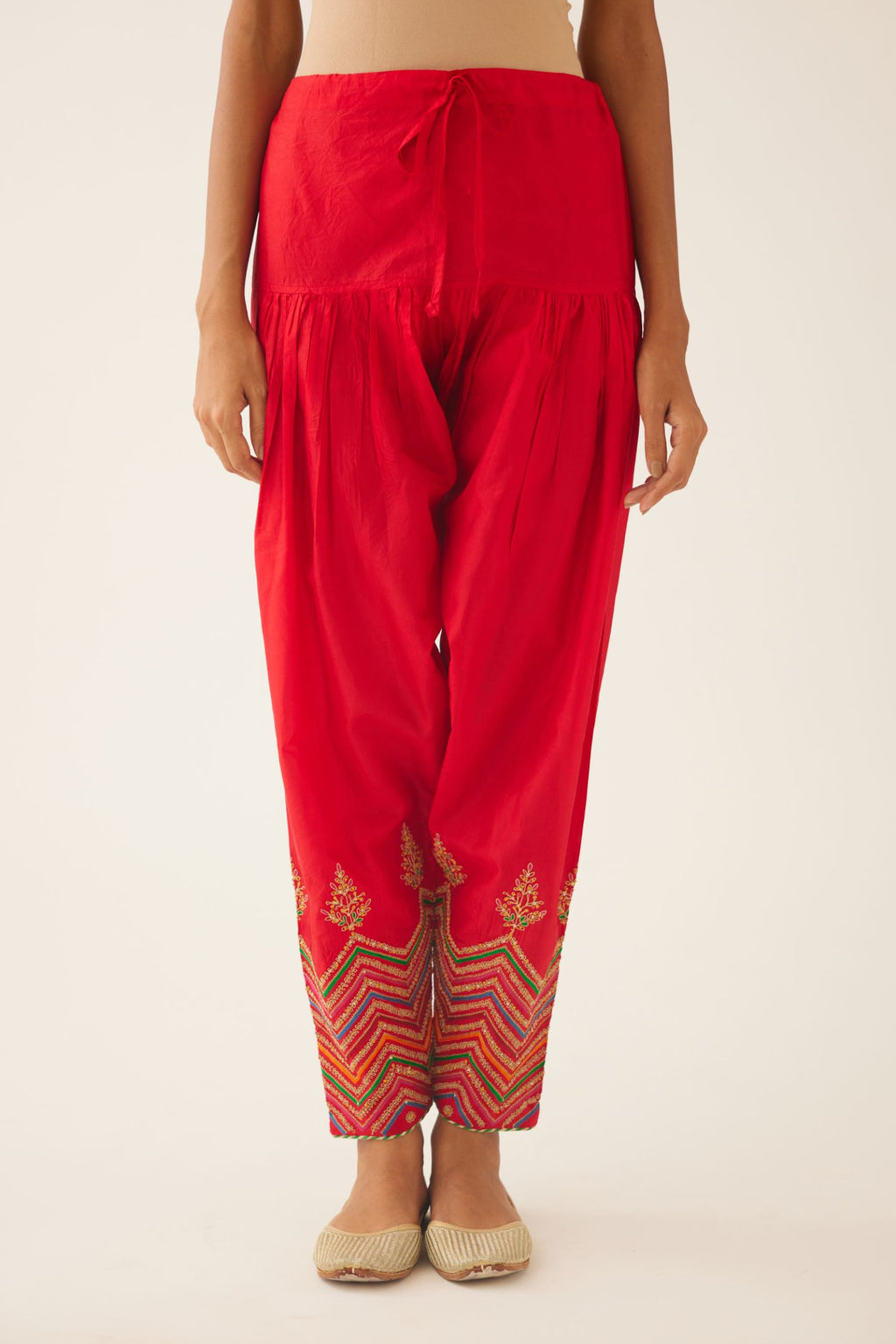 Red silk salwar detailed with dori, silk thread, bead & sequins embroidery.