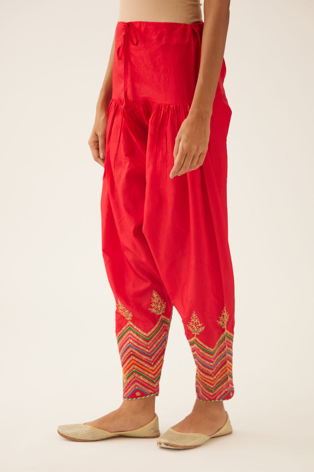 Red silk salwar detailed with dori, silk thread, bead & sequins embroidery.