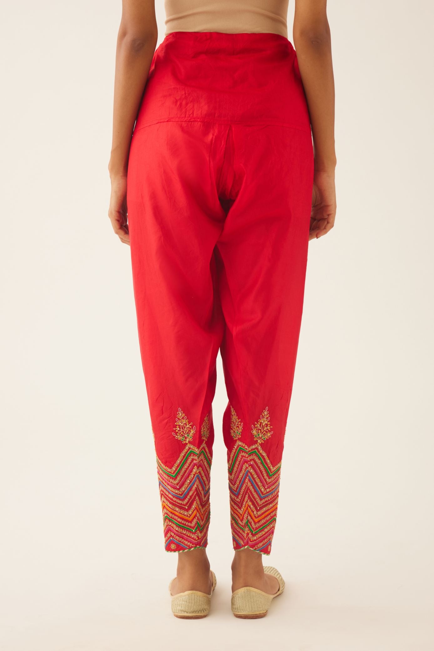 Red silk salwar detailed with dori, silk thread, bead & sequins embroidery.