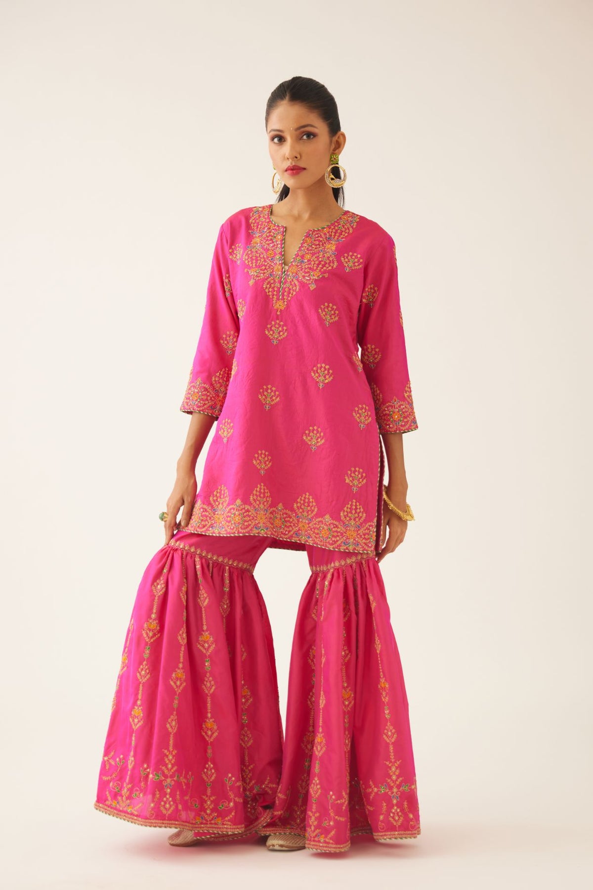 Raspberry silk short kurta set, with dori & silk thread embroidery highlighted with contrast bead & sequins work.