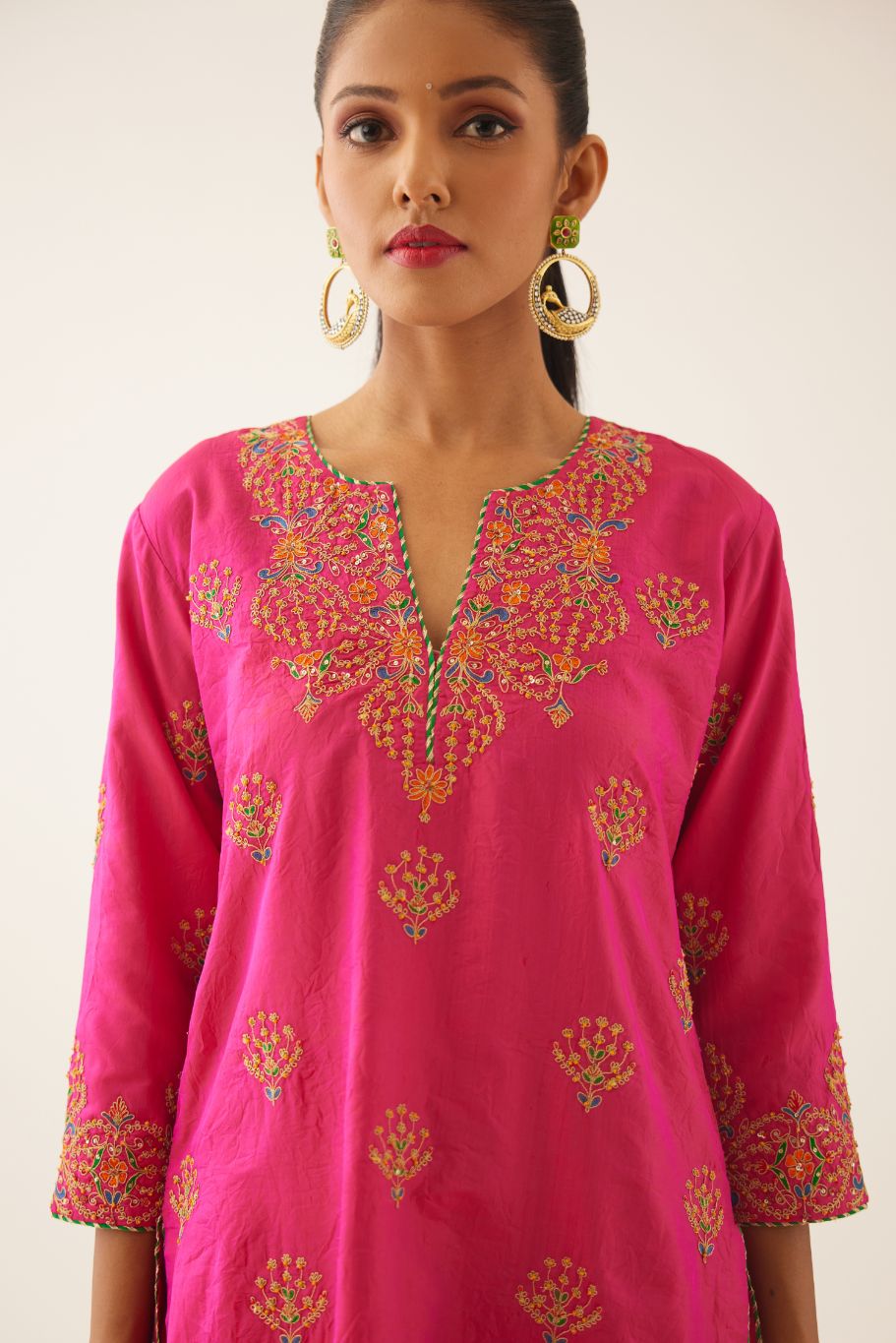 Raspberry silk short kurta set, with dori & silk thread embroidery highlighted with contrast bead & sequins work.