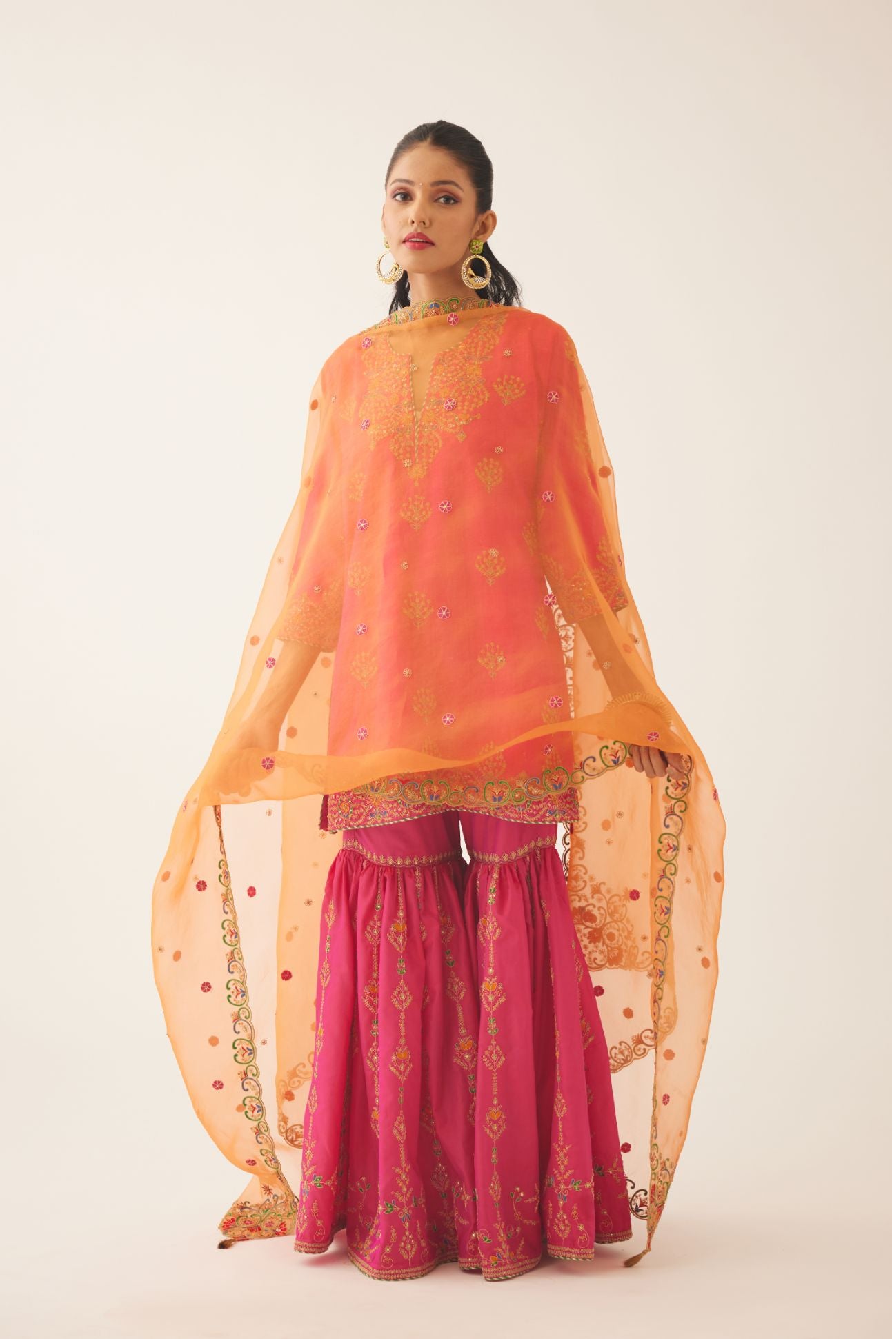 Raspberry silk short kurta set, with dori & silk thread embroidery highlighted with contrast bead & sequins work.