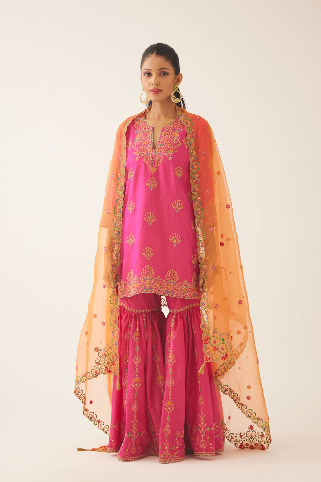 Raspberry silk short kurta set, with dori & silk thread embroidery highlighted with contrast bead & sequins work.