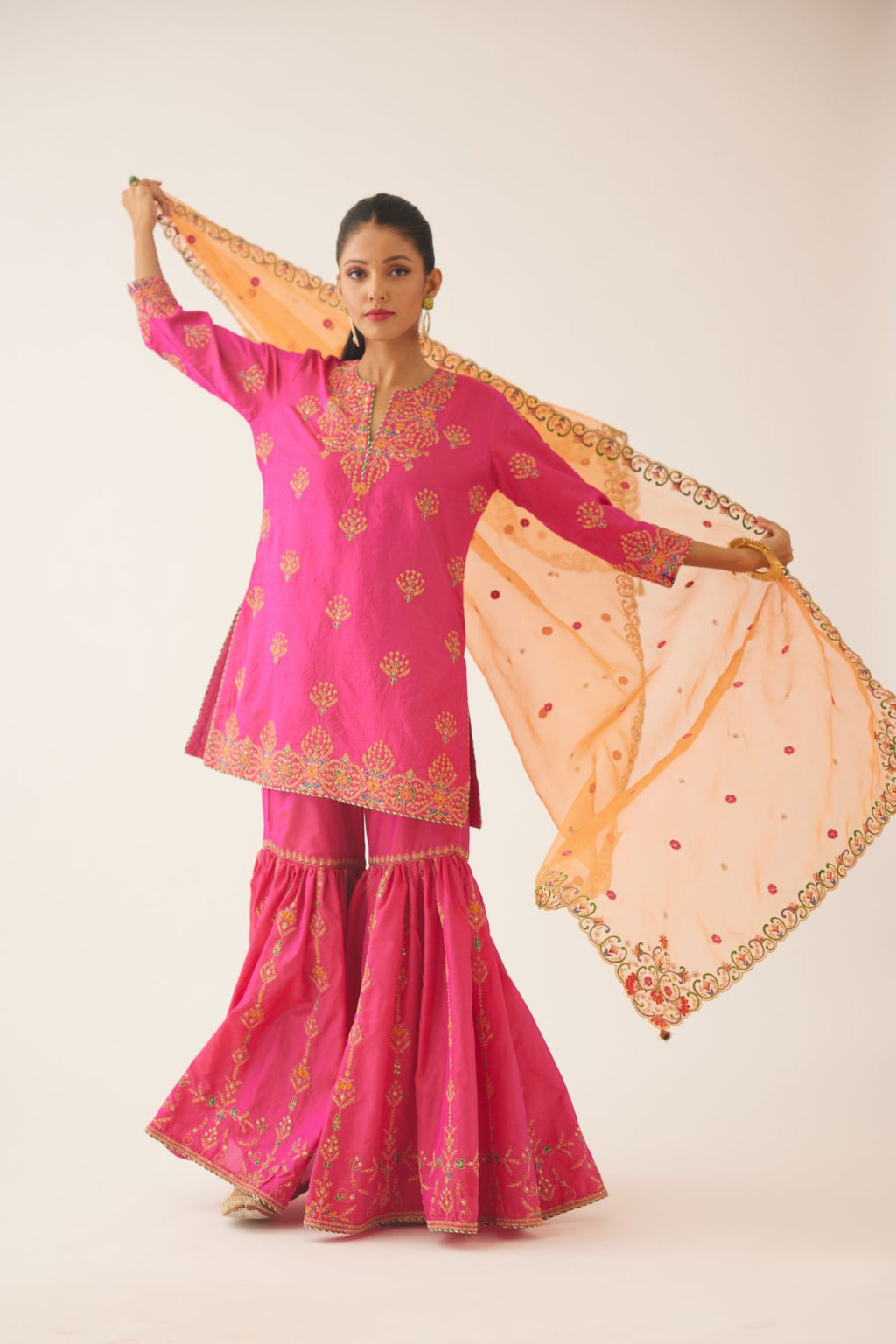 Raspberry silk short kurta set, with dori & silk thread embroidery highlighted with contrast bead & sequins work.