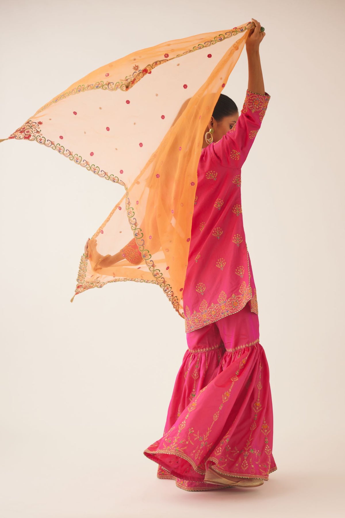 Raspberry silk short kurta set, with dori & silk thread embroidery highlighted with contrast bead & sequins work.