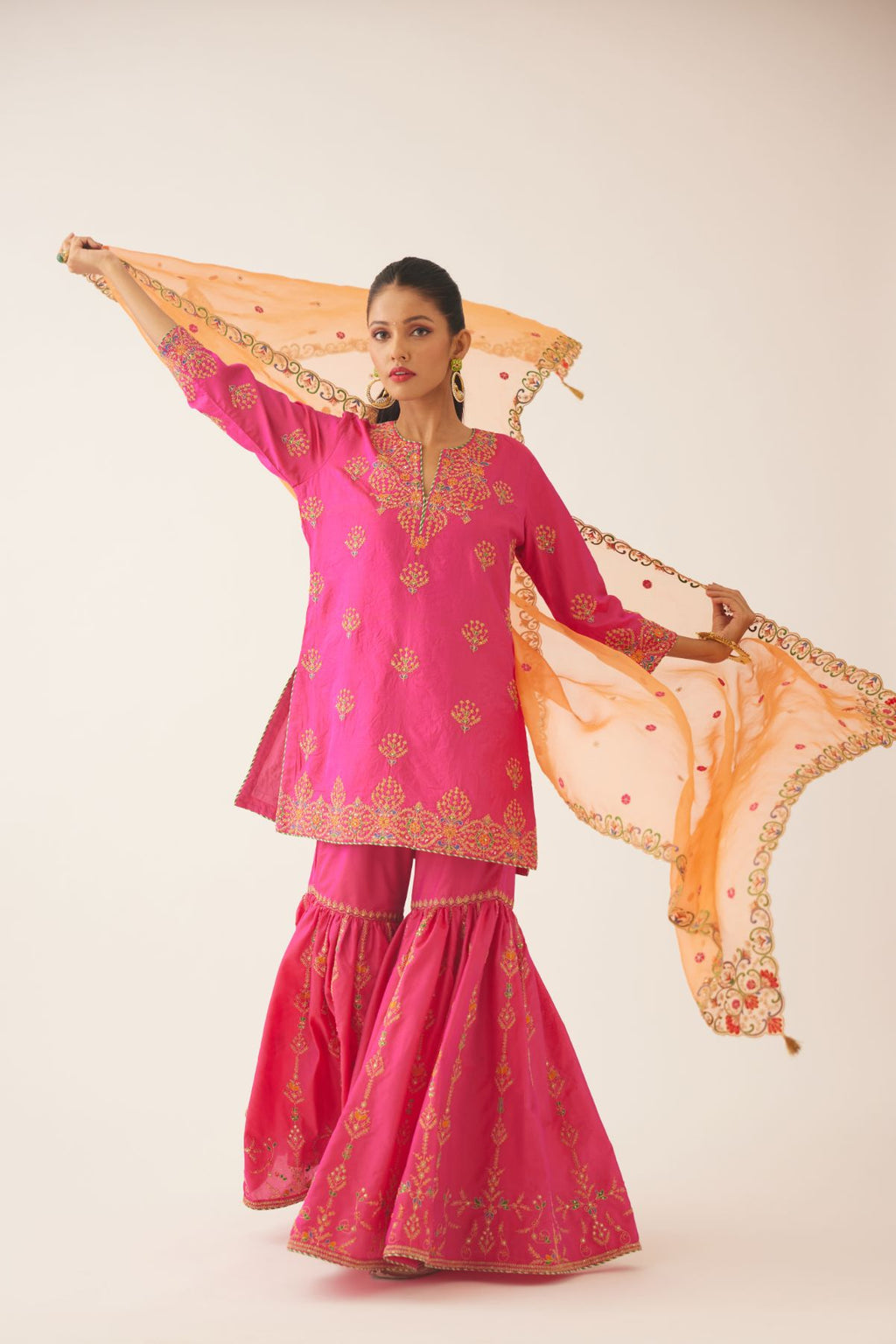 Raspberry silk short kurta set, with dori & silk thread embroidery highlighted with contrast bead & sequins work.