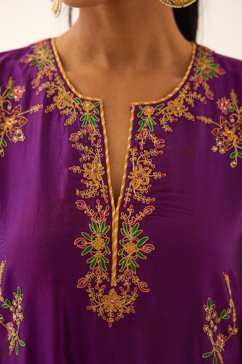 Plum purple straight silk kurta set with all over dori & silk thread embroidery highlighted with contrast bead & sequins work.