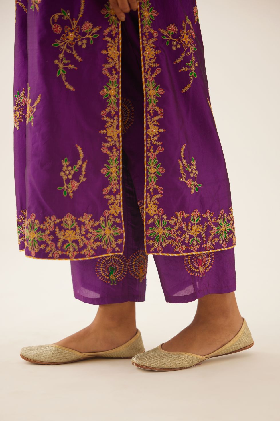 Plum purple straight silk kurta set with all over dori & silk thread embroidery highlighted with contrast bead & sequins work.