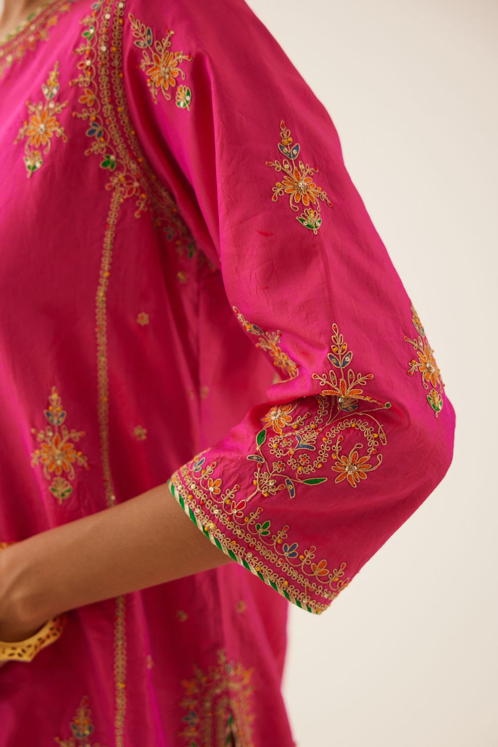 Raspberry silk kalidar straight kurta set with dori and silk thread embroidery, highlighted with bead and sequins work.