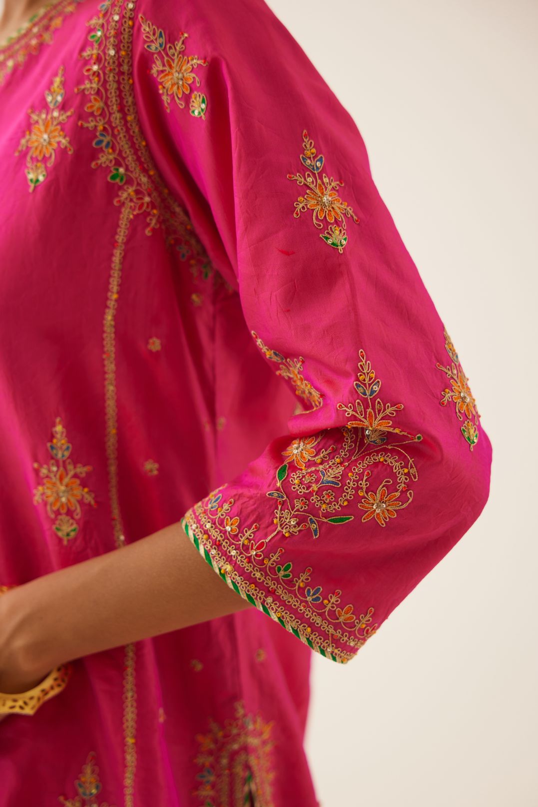Raspberry silk kalidar straight kurta set with dori and silk thread embroidery, highlighted with bead and sequins work.
