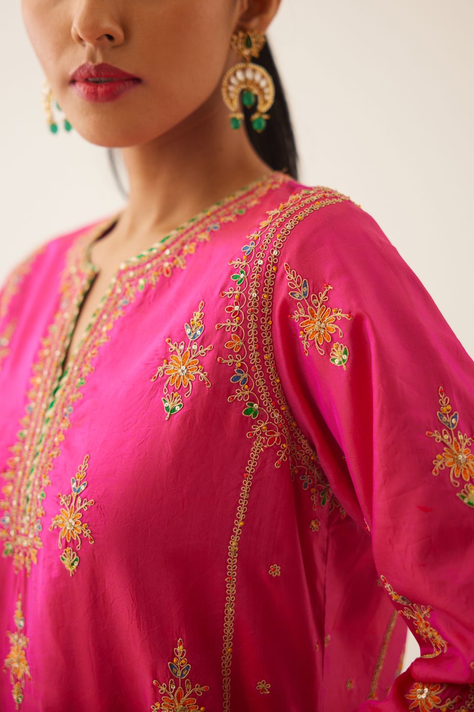 Raspberry silk kalidar straight kurta set with dori and silk thread embroidery, highlighted with bead and sequins work.