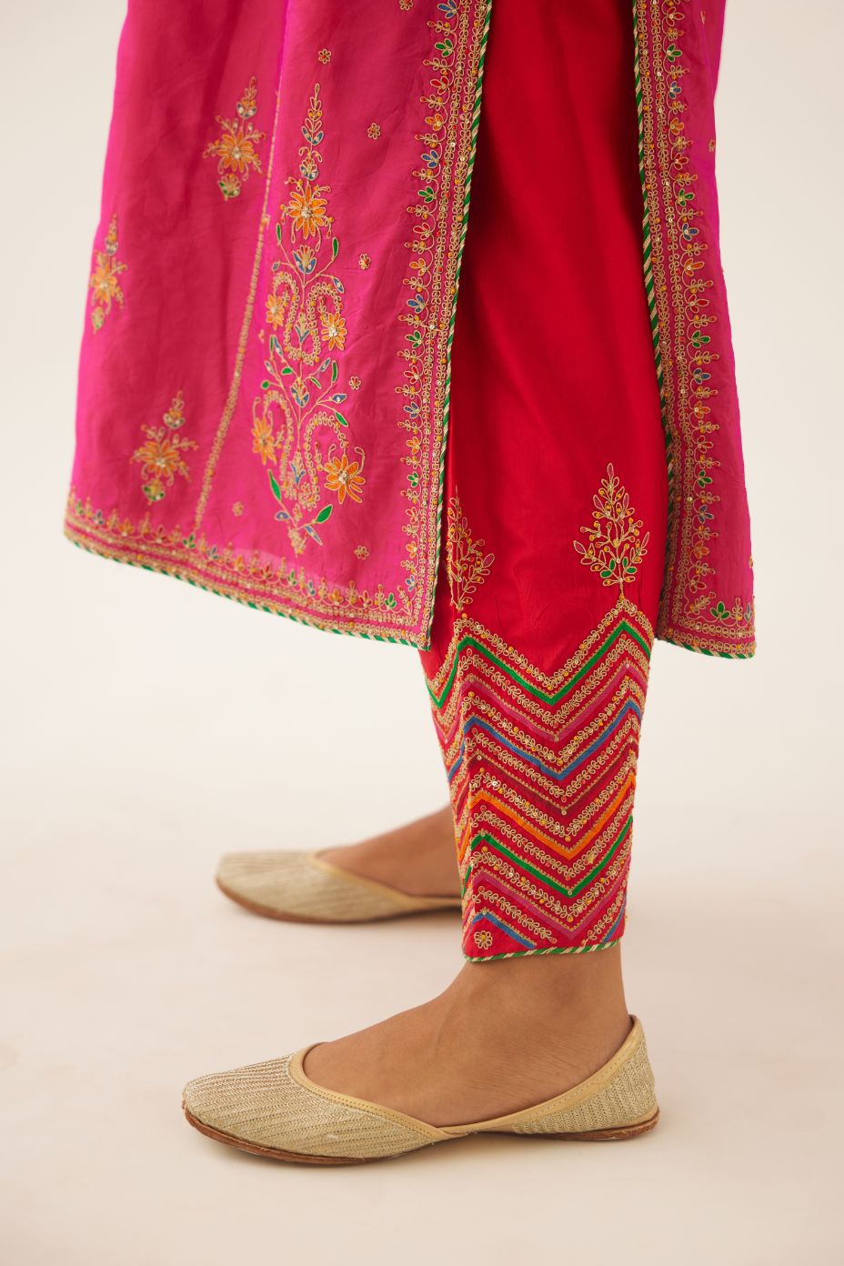 Raspberry silk kalidar straight kurta set with dori and silk thread embroidery, highlighted with bead and sequins work.