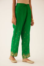 Green silk pants, hem is detailed with zari & gota embroidery