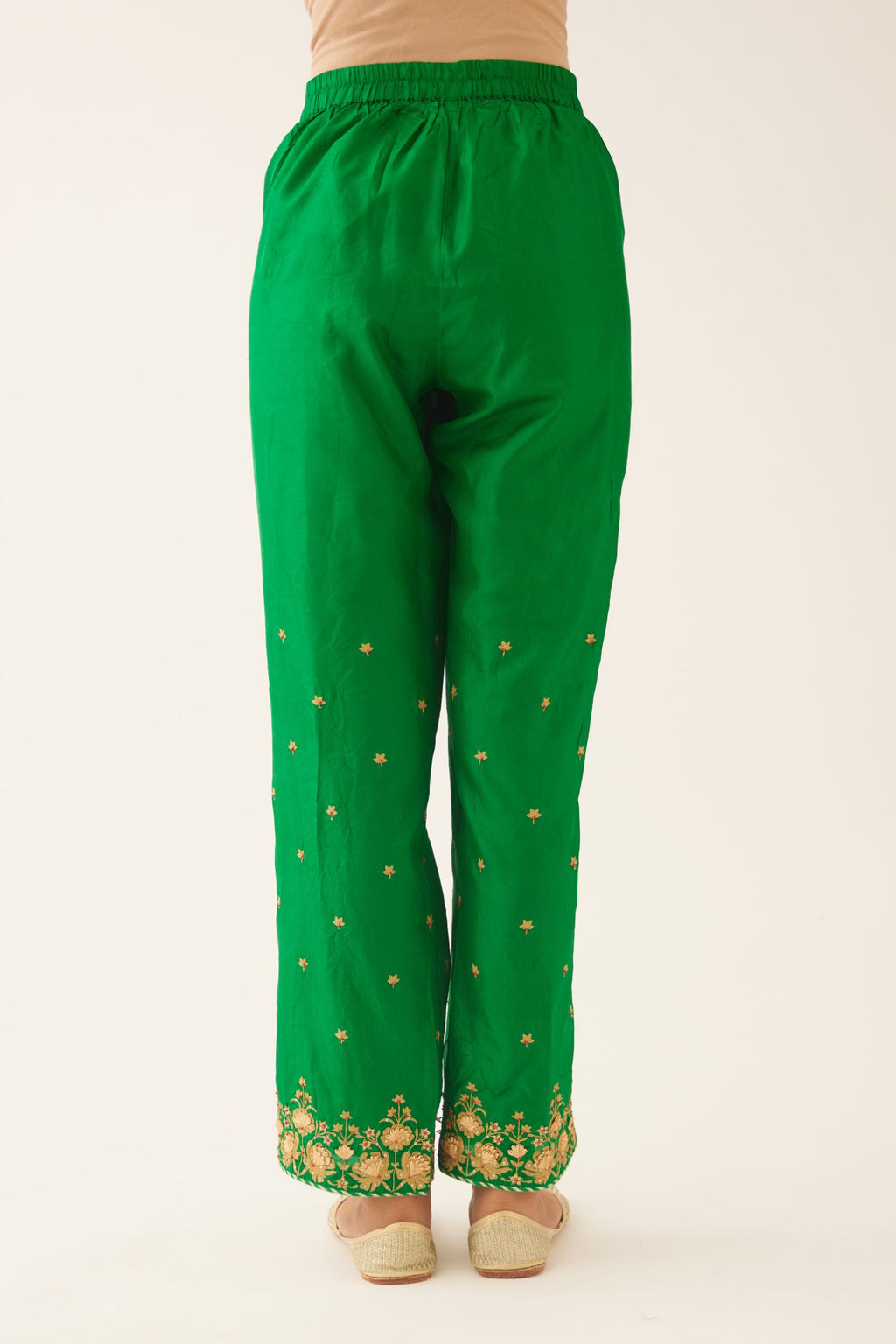 Green silk pants, hem is detailed with zari & gota embroidery