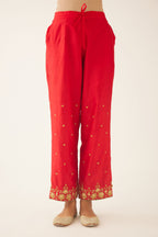 Red silk pants, hem is detailed with zari & gota embroidery