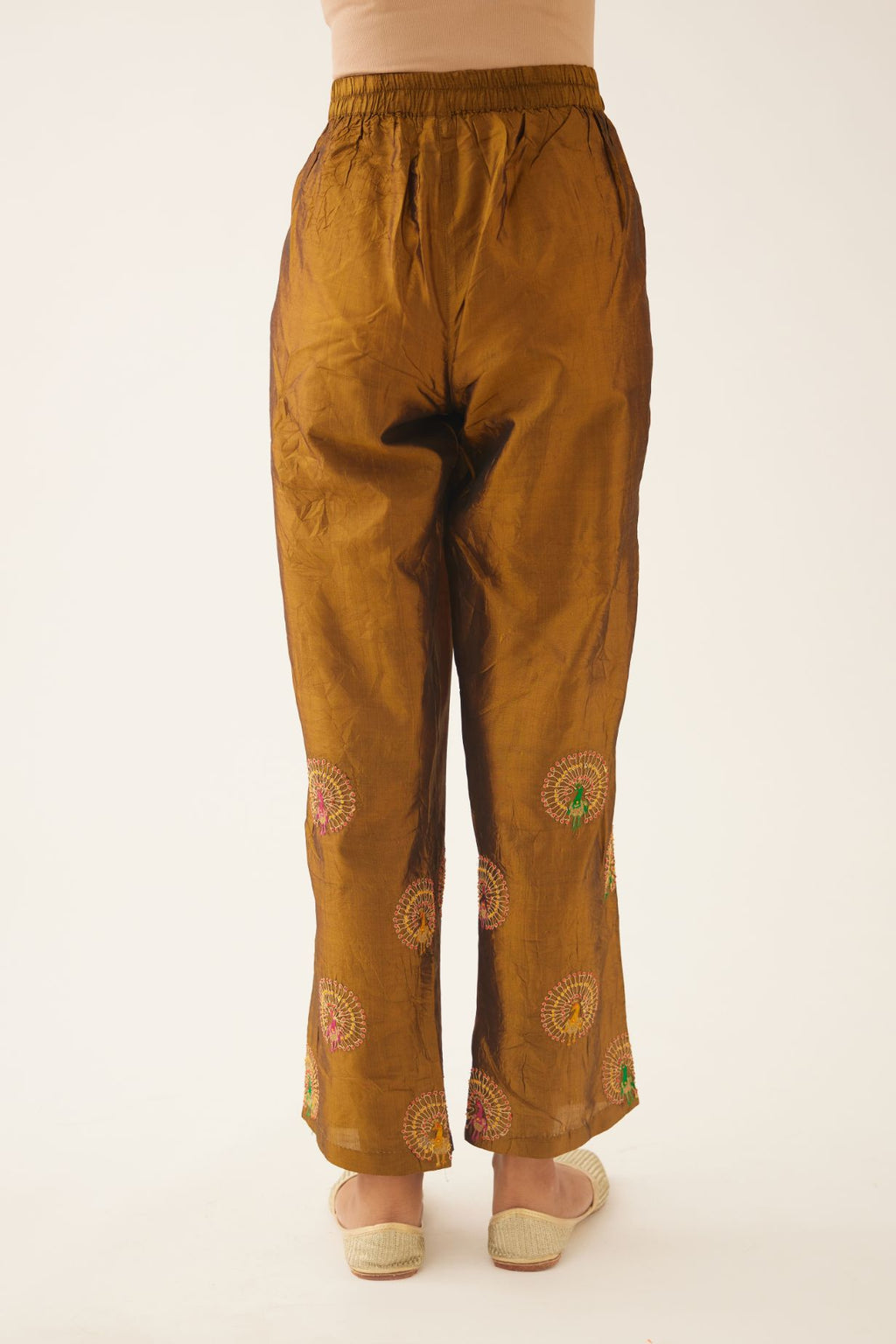 Golden olive silk straight pants with dori and silk thread embroidery.