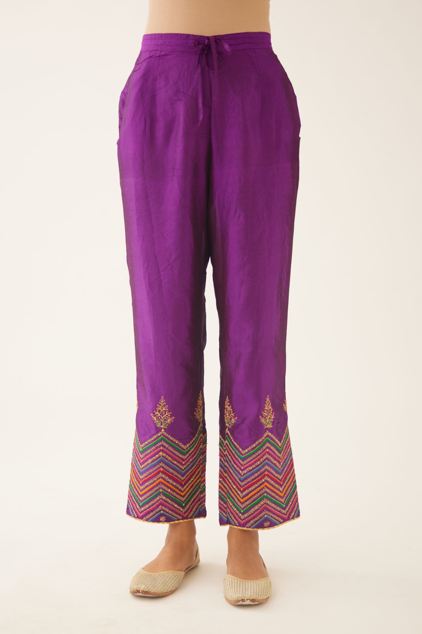 Plum purple silk pants detailed with dori, silk thread, bead & sequins embroidery.
