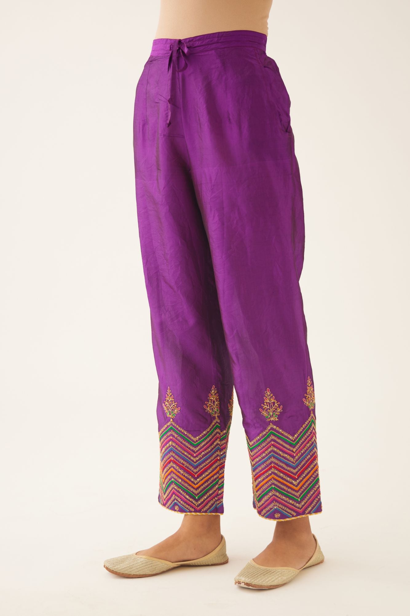 Plum purple silk pants detailed with dori, silk thread, bead & sequins embroidery.