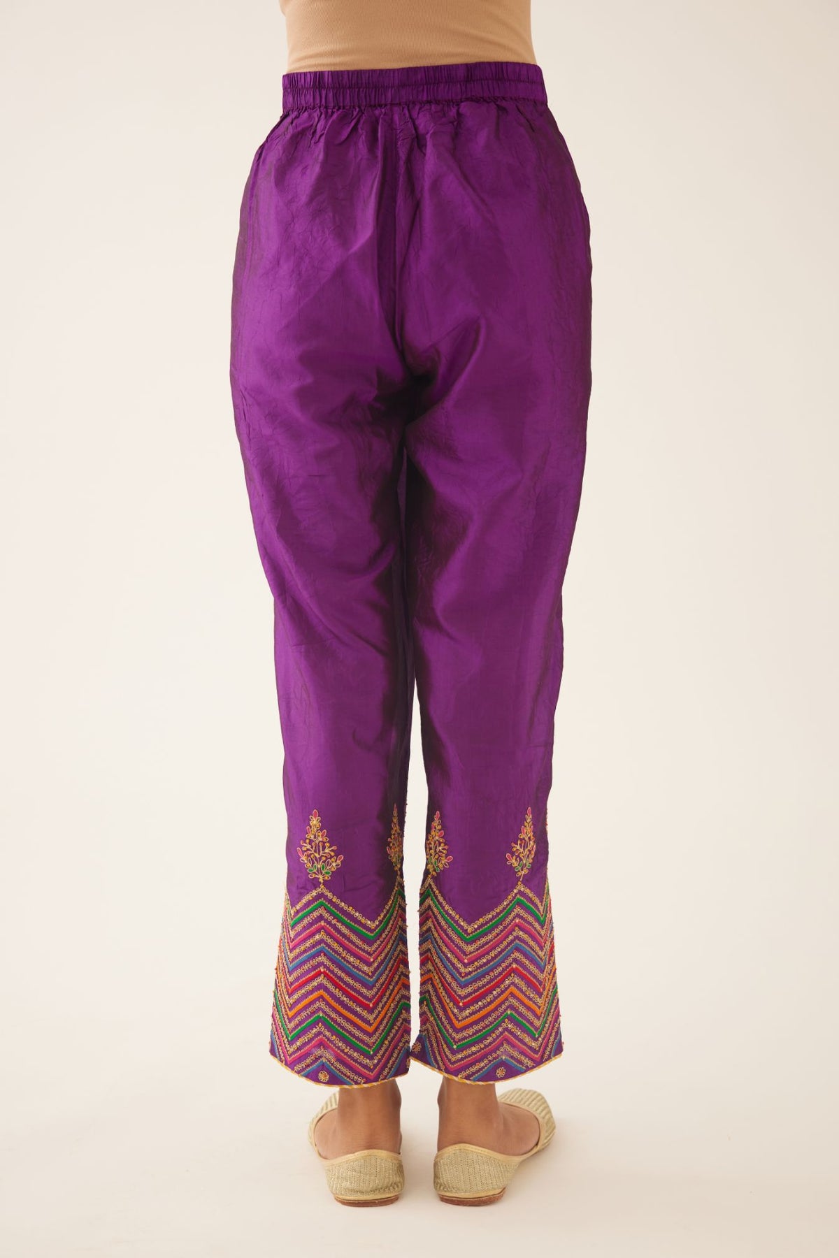 Plum purple silk pants detailed with dori, silk thread, bead & sequins embroidery.