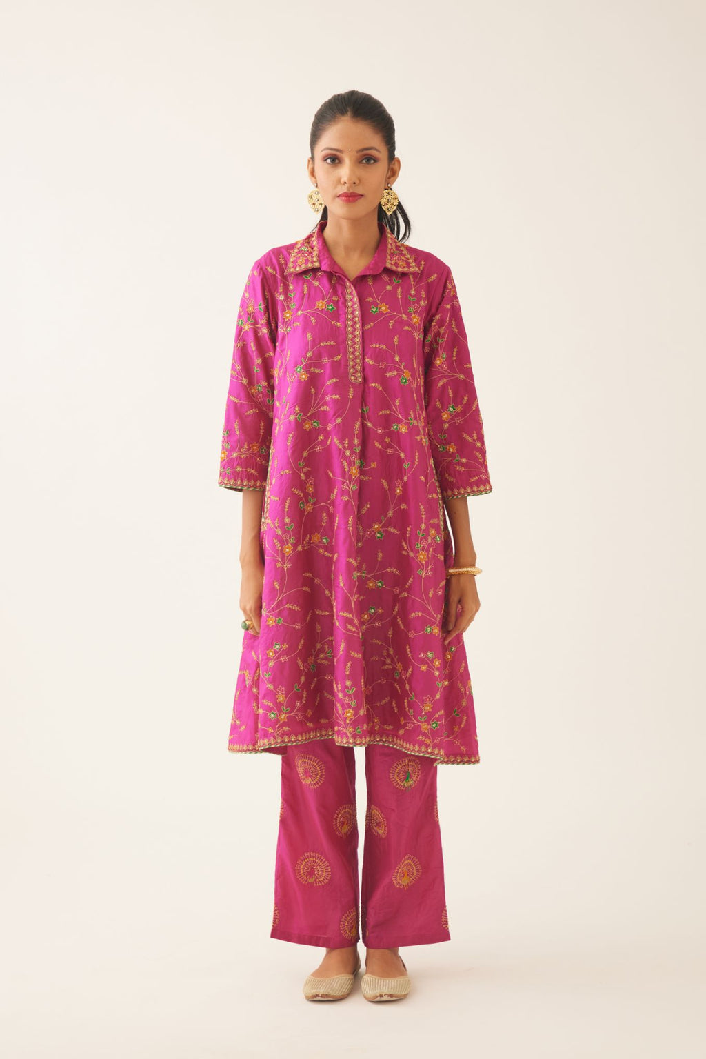 Jazz berry A-line short silk kurta set with all over embroidery, highlighted with sequins and bead work, paired with Jaz berry silk straight pants with dori and silk thread embroidery.