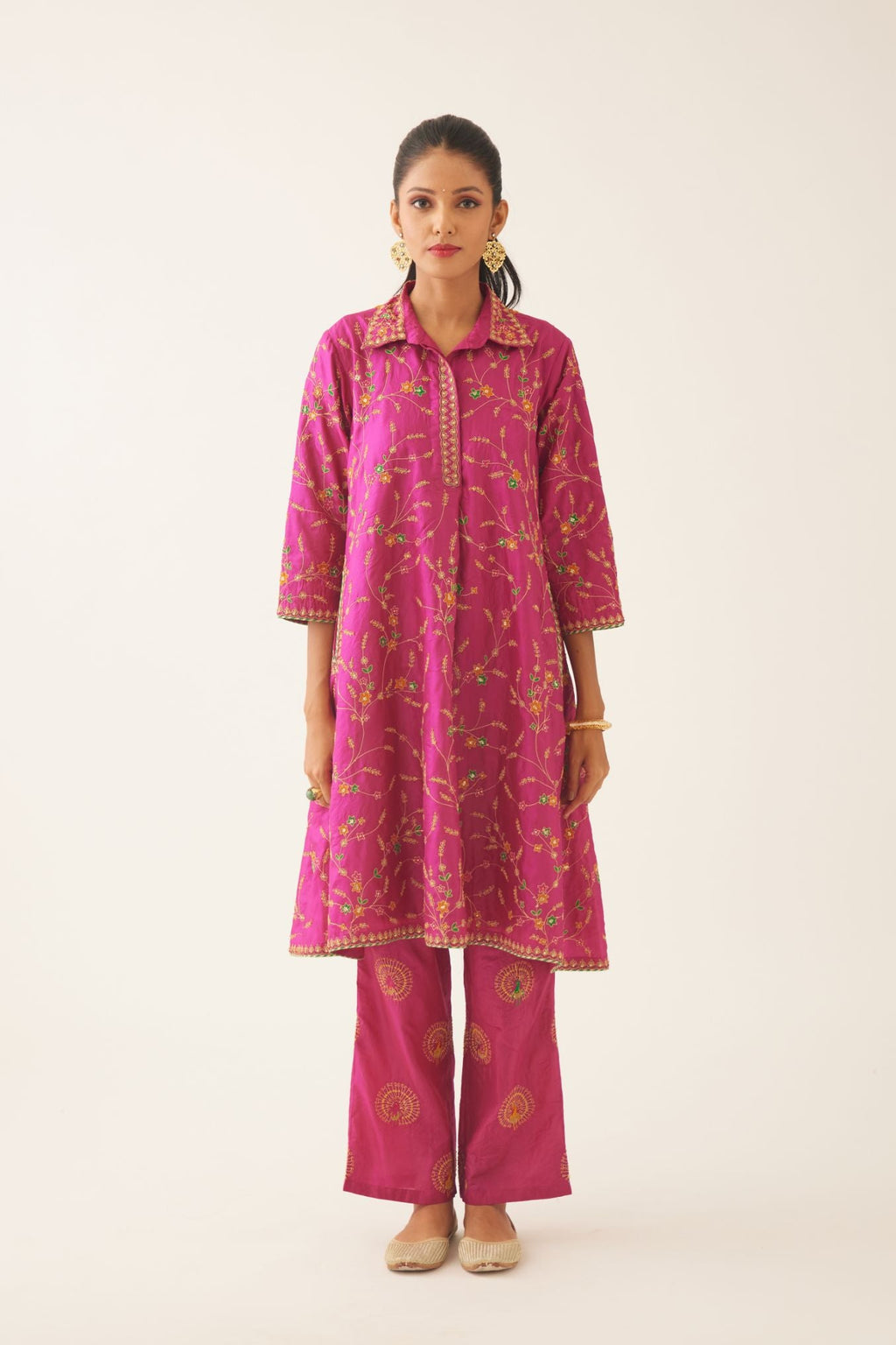 Jazz berry A-line short silk kurta set with all over embroidery, highlighted with sequins and bead work, paired with Jaz berry silk straight pants with dori and silk thread embroidery.