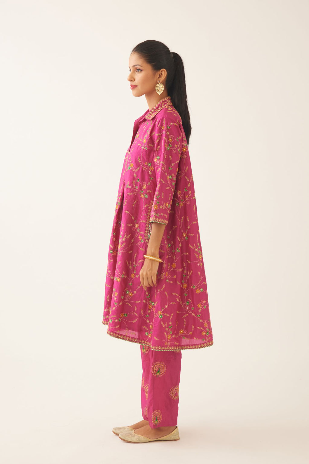Jazz berry A-line short silk kurta set with all over embroidery, highlighted with sequins and bead work, paired with Jaz berry silk straight pants with dori and silk thread embroidery.