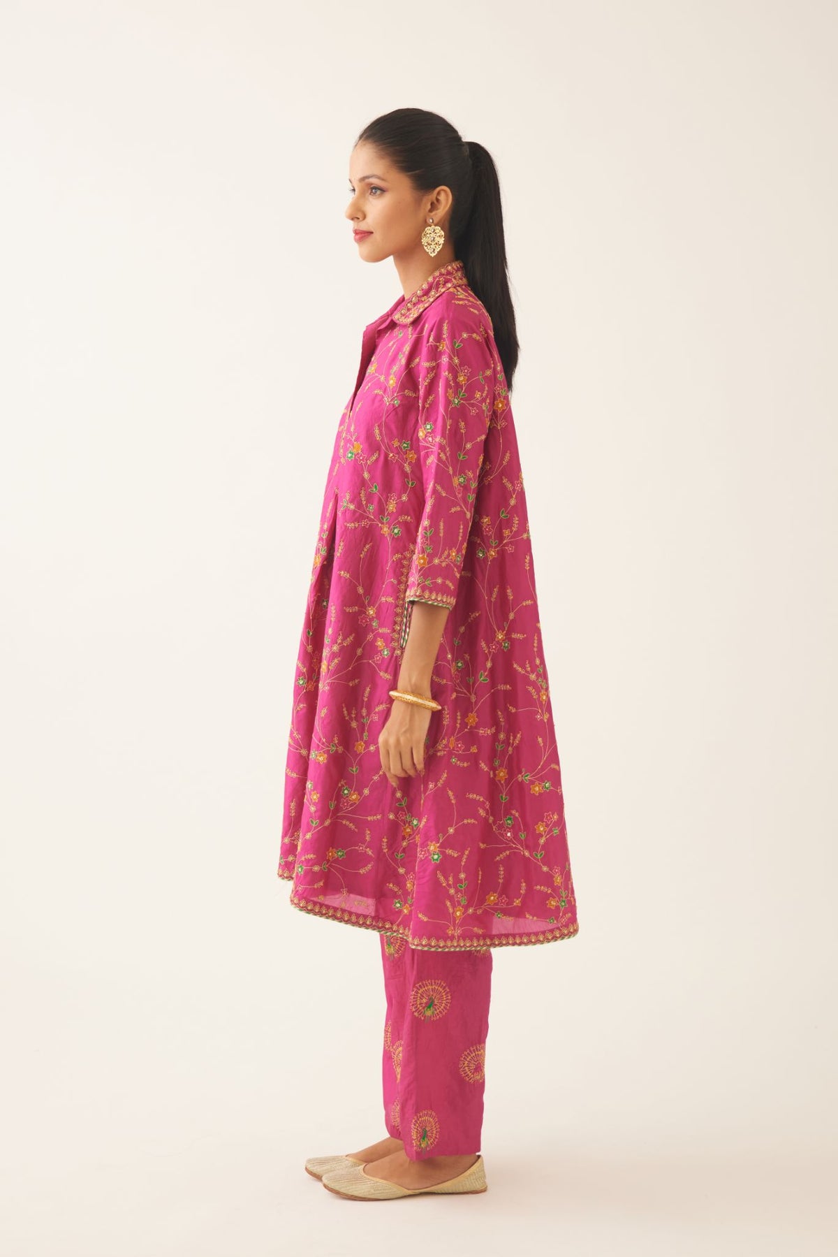 Jazz berry A-line short silk kurta set with all over embroidery, highlighted with sequins and bead work, paired with Jaz berry silk straight pants with dori and silk thread embroidery.