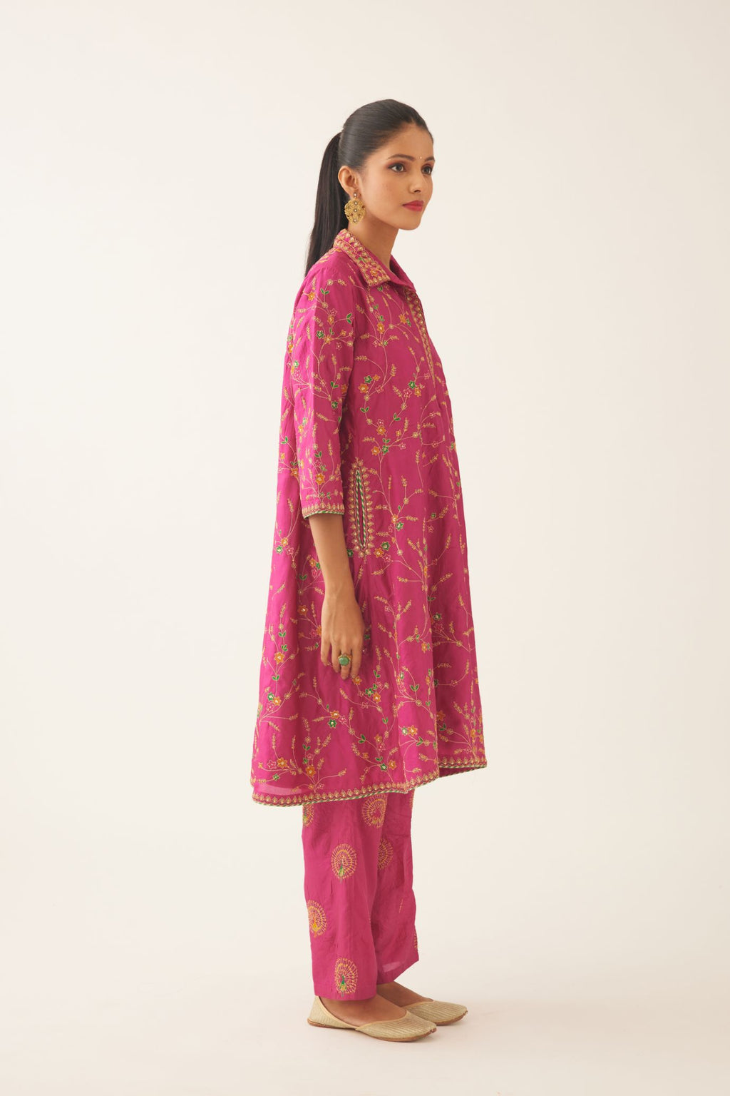Jazz berry A-line short silk kurta set with all over embroidery, highlighted with sequins and bead work, paired with Jaz berry silk straight pants with dori and silk thread embroidery.