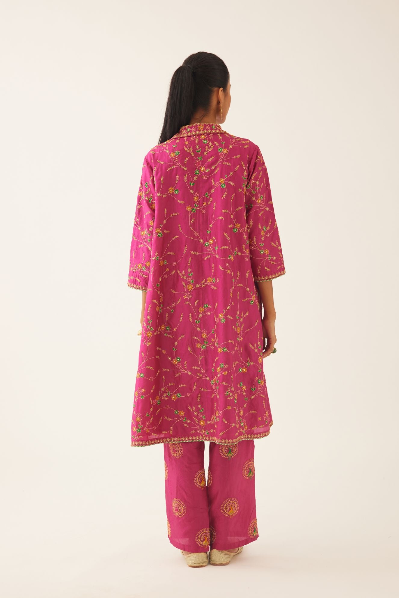 Jazz berry A-line short silk kurta set with all over embroidery, highlighted with sequins and bead work, paired with Jaz berry silk straight pants with dori and silk thread embroidery.