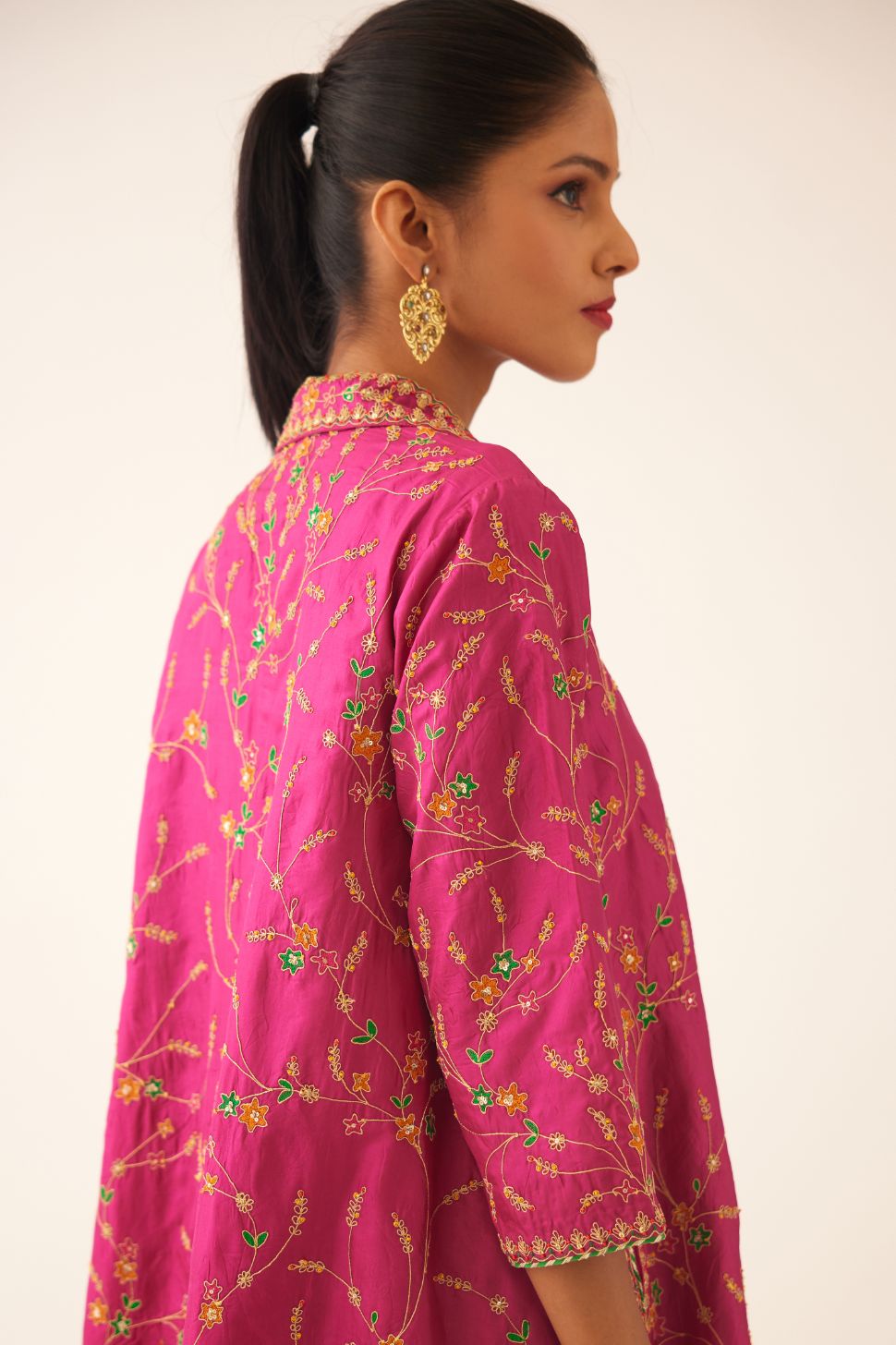 Jazz berry A-line short silk kurta set with all over embroidery, highlighted with sequins and bead work, paired with Jaz berry silk straight pants with dori and silk thread embroidery.