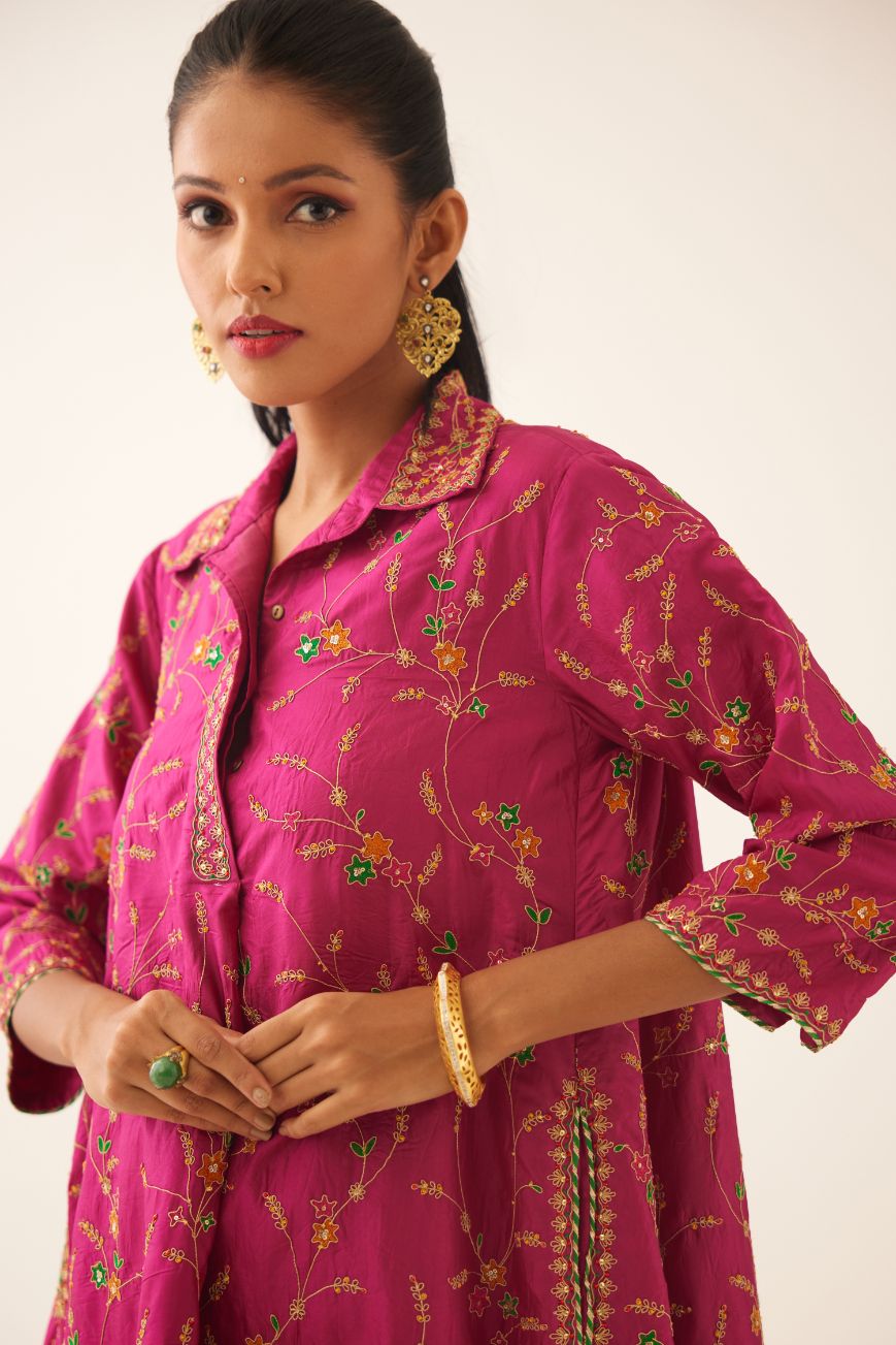 Jazz berry A-line short silk kurta set with all over embroidery, highlighted with sequins and bead work, paired with Jaz berry silk straight pants with dori and silk thread embroidery.